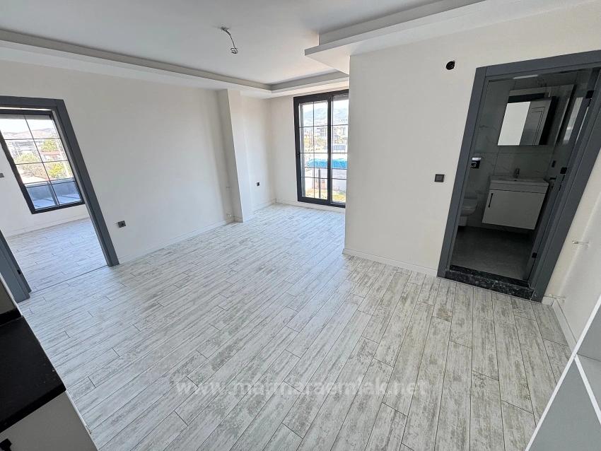 1+1 Mid-Floor Apartment For Sale In Doğanbey, Seferihisar, 60 Meters From The Sea.