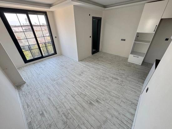 1+1 Mid-Floor Apartment For Sale In Doğanbey, Seferihisar, 60 Meters From The Sea.