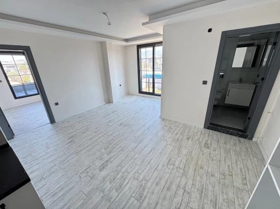 1+1 Mid-floor Apartment For Sale In Doğanbey, Seferihisar, 60 Meters From The Sea.